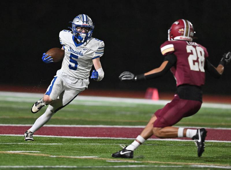 Woodstock's Jared Kay (5) in action during the class 4A first round playoff game against Morris on Friday, OCT. 31, 2025, at Morris.