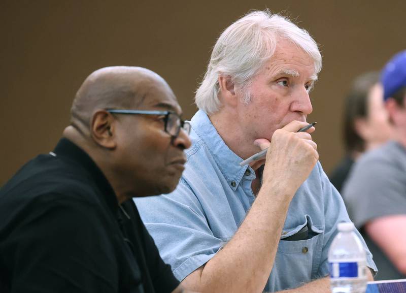 Ellingsworth Webb, (left) and Dan Kenney, both of DeKalb, listen as State Rep. Amy “Murri” Briel, D-Ottawa, speaks Friday, July 11, 2025, during her town hall at at Northern Illinois University’s Holmes Student Center in DeKalb. Briel will be hosting town halls later this year in Oglesby and Utica.