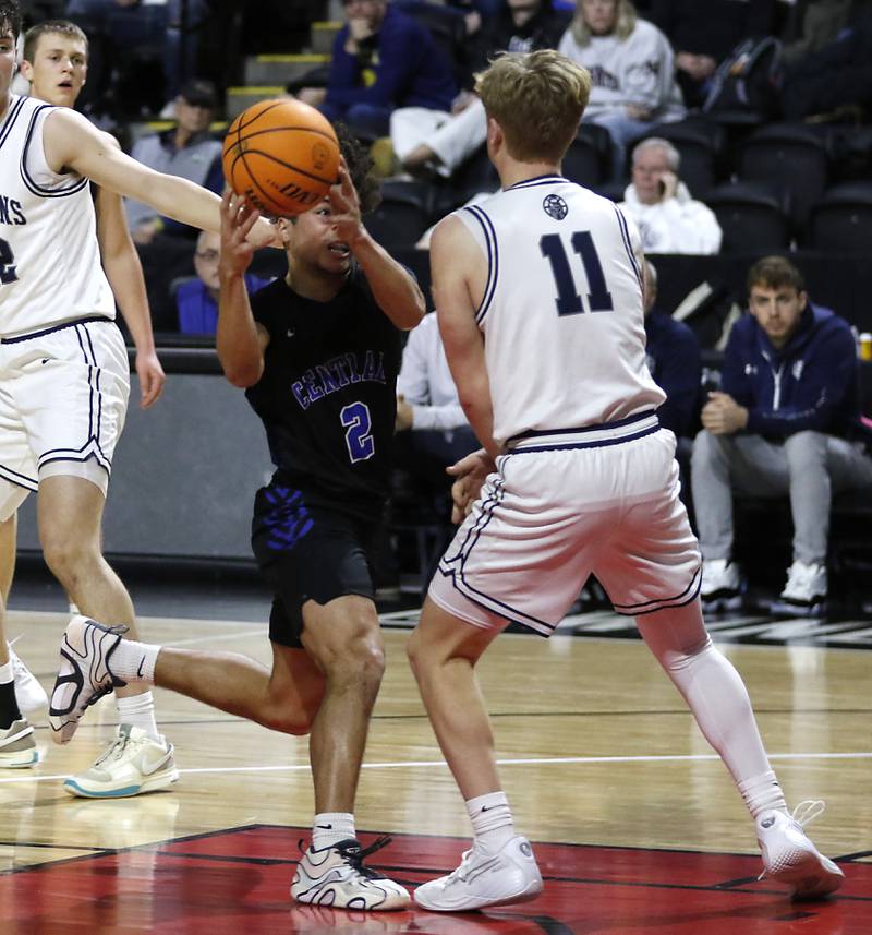 Burlington Central's Caden West drives the lane against Cary-Grove's Landon Nawracaj during a Fox Valley Conference basketball game on Tuesday, Jan. 14, 2025, at Now Arena in Hoffman Estates.