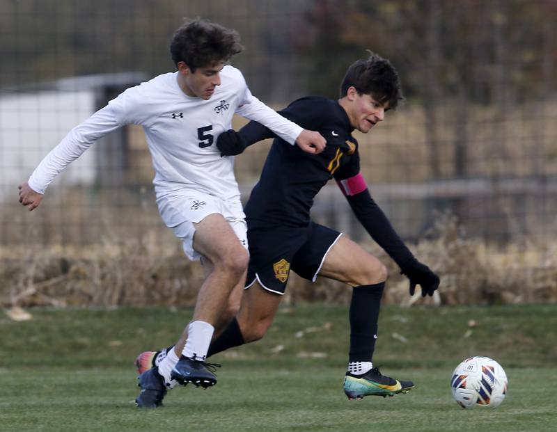 Richmond-Burton's Jack Meyer (right) tries to get position to take a shot on goal as F.W. Parker's F.W. Parker's Heath Albert defends during an IHSA Class 1A Johnsburg Sectional semifinal match on Oct. 28, 2025, at Johnsburg High School.