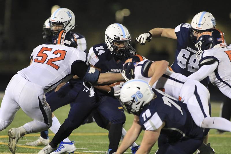 Plainfield Souths Keith Bronson (24) runs for tough yards during football game between Oswego at Plainfield South. March 19.