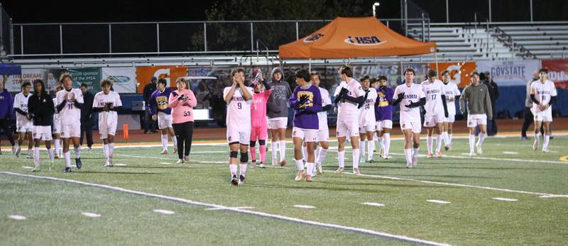 Members of the Mendota soccer team show fans support after loosing to Normal U-High during the Class 1A State semifinal game on Thursday, Nov. 7, 2024 at Hoffman Estates High School.