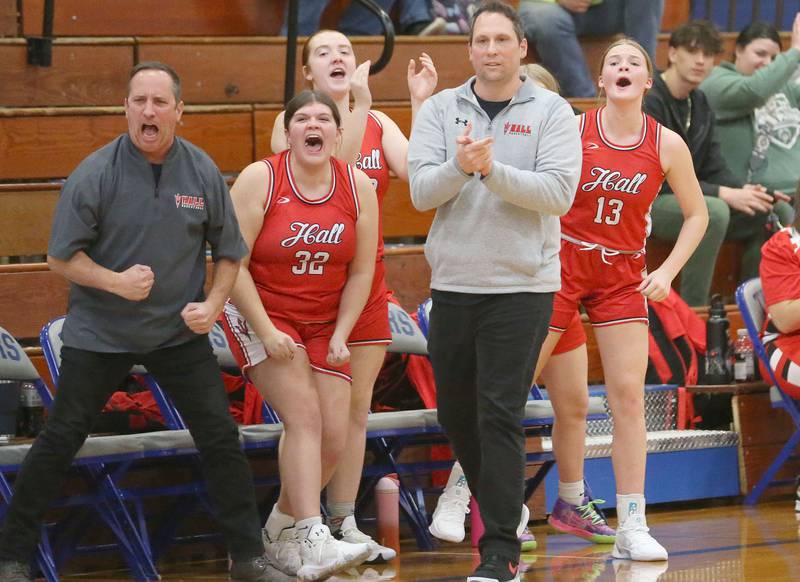 Hall coaches Mark Mautino, TJ Orlandi and players (from left) Ashland Hansen Kaylee Lauck, and Caroline Morris react after scoring a basket against Illinois Valley Central during the Princeton Holiday Girls Basketball Tournament on Tuesday, Nov. 19, 2024 at Princeton High School.