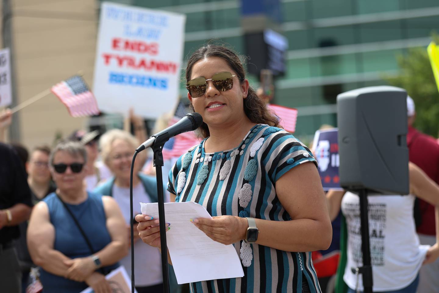 Sylvia Acosta Chavez, executive director of the Spanish Community Center in Joliet, speaks at the No Kings Day protest on Saturday, June 14, 2025 in Joliet.