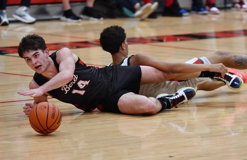 Benet's Parker Sulaver reaches for a loose ball after colliding with Bolingbrook's Davion Thompson during a Class 4A East Aurora Sectional semifinal game on Feb. 27, 2024 at East Aurora High School in Aurora.