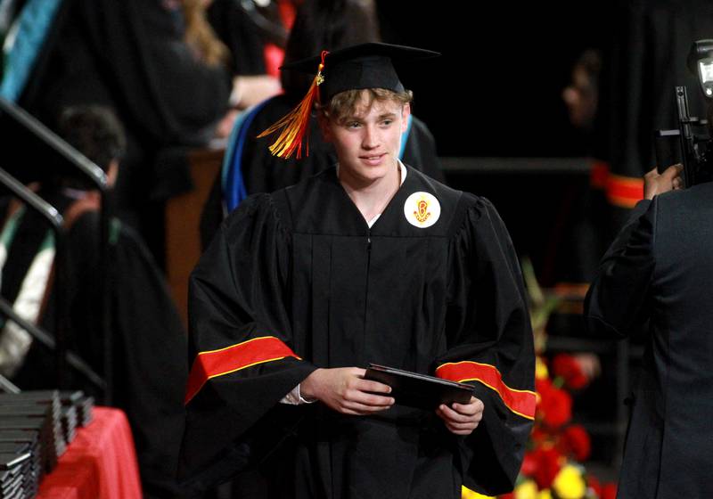 Batavia High School graduate Carson Albaugh crosses the stage during the school’s 2025 commencement ceremony on Wednesday, May 21, 2025 at Northern Illinois University in DeKalb.