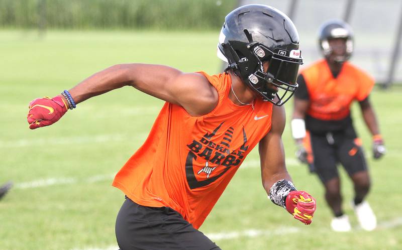 Ethan McCarter breaks from the line of scrimmage during a 7-on-7 with Kaneland Tuesday, July 26, 2022, at Kaneland High School in Maple Park.