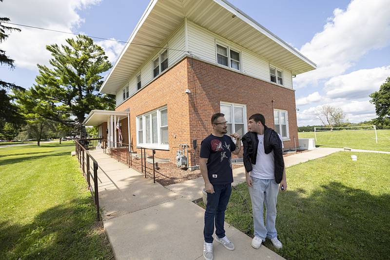 Nikola Balaban (left), 31, and Michael Johnson, 20, talk outside of the Sinnissippi Centers’ Recovery Home on Thursday, July 18, 2024.