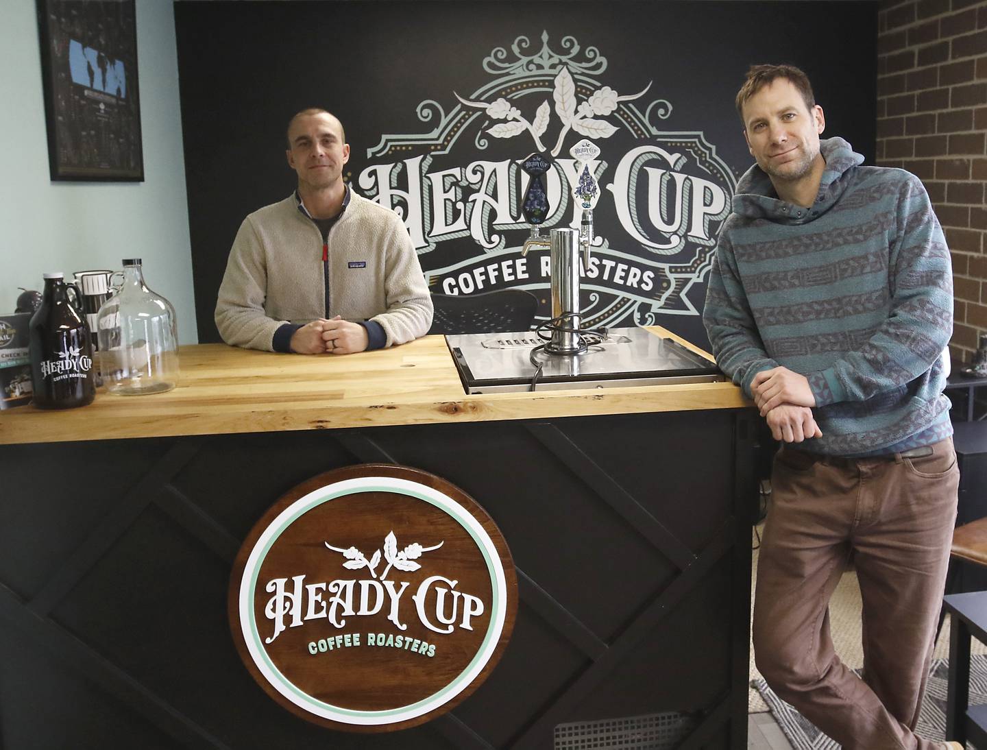 Kevin Foglesong and Michael Kivland, the co-owners of Heady Cup Coffee Roasters, on Friday, Feb. 14, 2025, at their business in McHenry.
