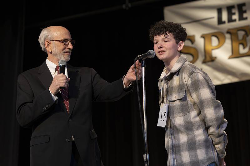 Pronouncer Tom Wadsworth speaks with Amboy Junior High’s Parker Zimmerly Thursday, Feb. 20, 2025, after the eighth grader won the Lee, Ogle, Whiteside County Spelling Bee.