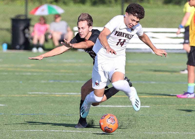 Yorkville's Ismae González trips up DeKalb's Tyler Diedrich during their game Thursday, Aug. 25, 2022, in the Barb Cup at the Northern Illinois University Outdoor Recreation Sports Complex.