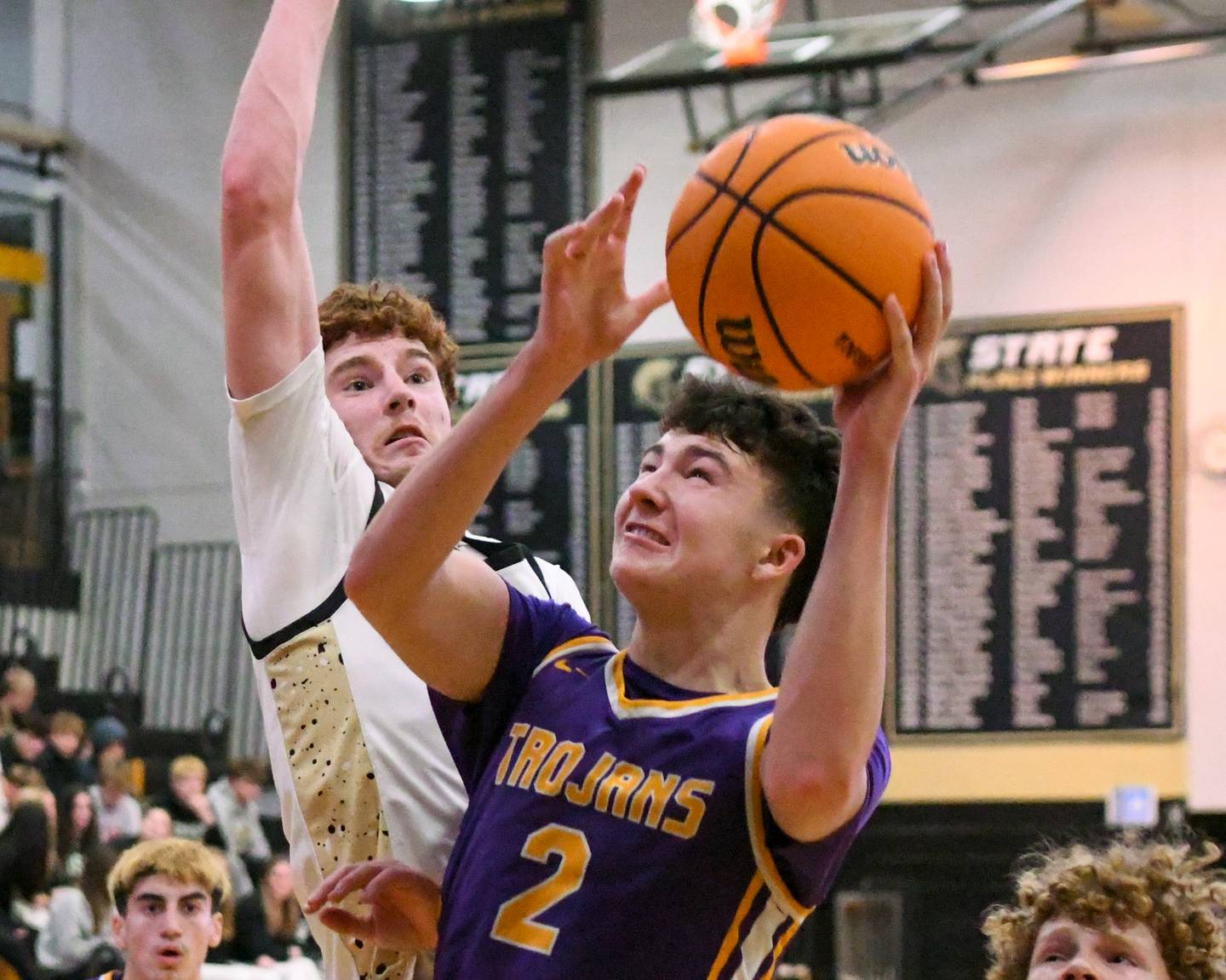Mendota's Drew Becker (2) takes a shot during the game on Wednesday Dec. 17, 2025, while being defended by Sycamore's Aidan Mesenbrink (23) held at Sycamore High School.