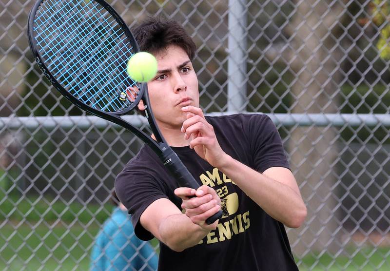 Sycamore number one doubles player Javi Lopez returns a serve Thursday, April 24, 2025, during their match against DeKalb at Sycamore High School.