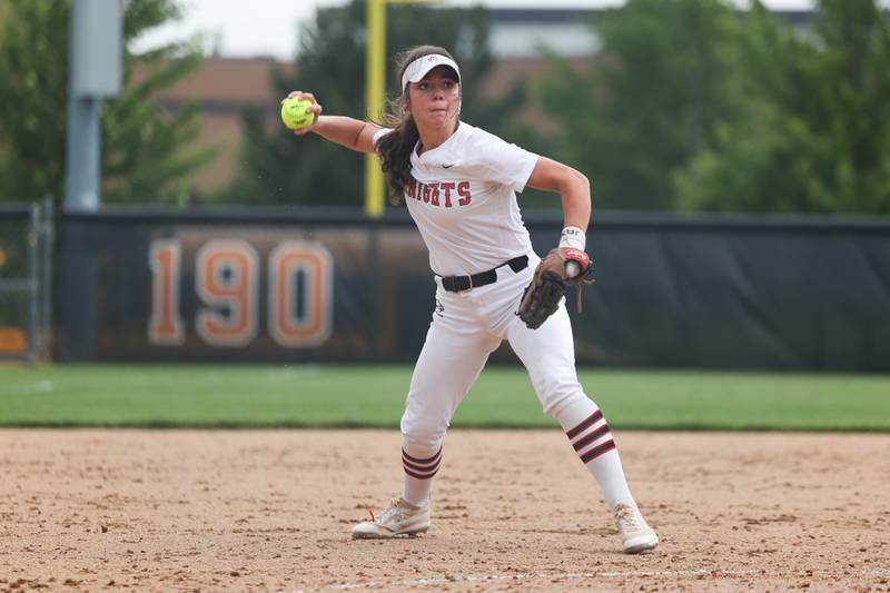 Lincoln-Way Central’s Mia Guide throws to first for the out against Lincoln-Way West on Tuesday, May 14, 2024 in New Lenox.