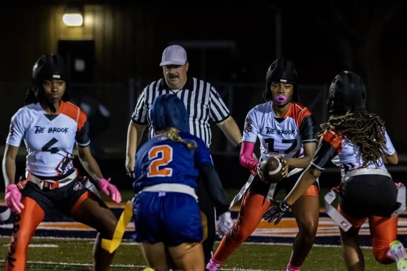 Bolingbrook's Janiya Frazier looks for an open teammate during a varsity flag football Romeoville Regional semifinal game against Romeoville at Romeoville on Oct. 7, 2025.