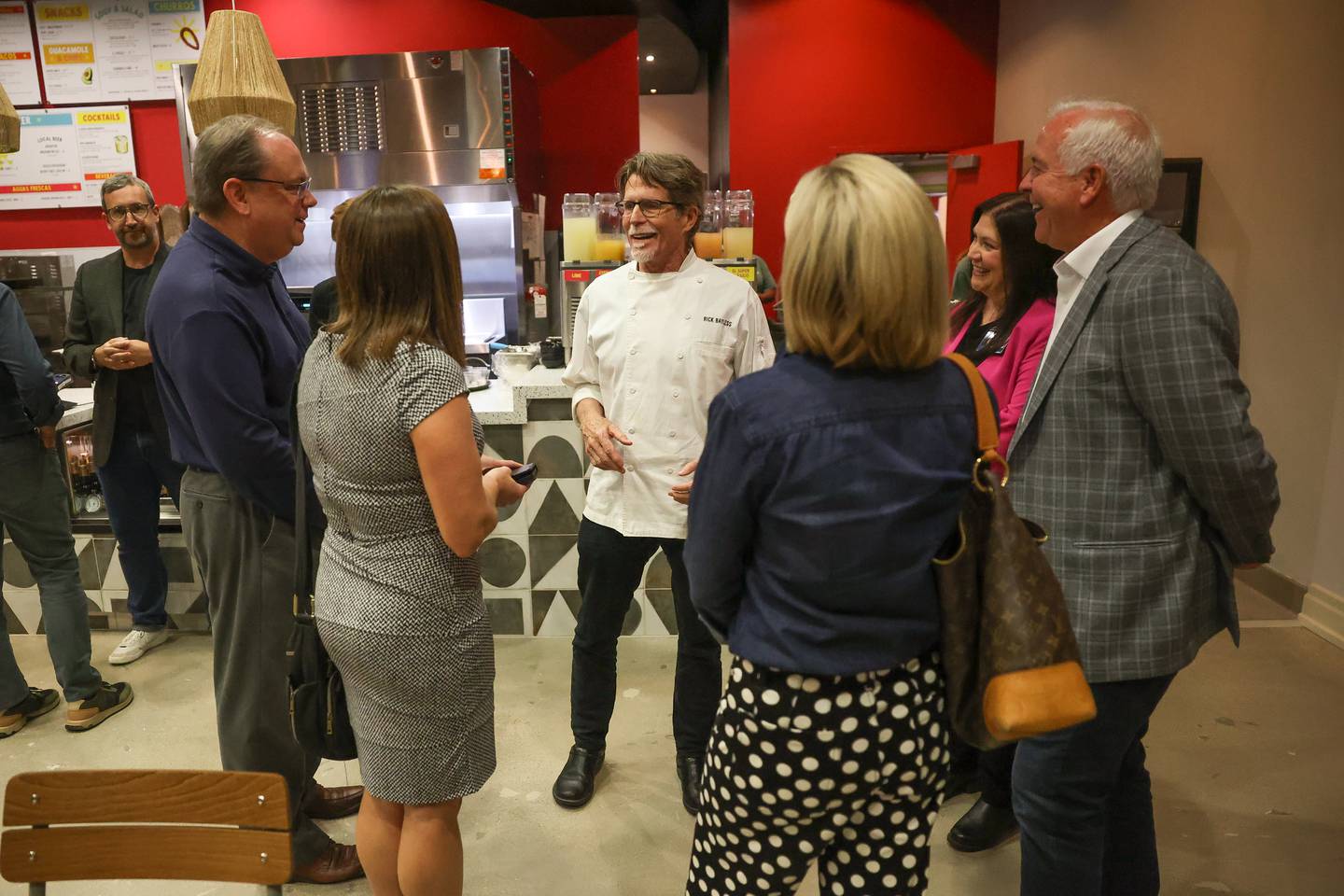 Chef Rick Bayless talks with guest at the opening of Tortazo restaurant inside Harrah’s Casino Joliet on Friday, Oct. 4, 20234 in Joliet.