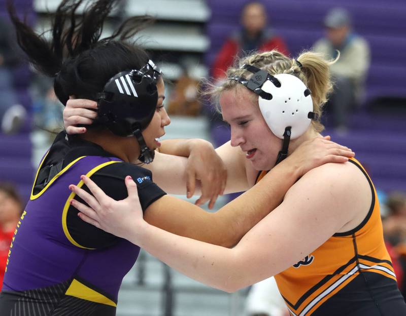 McHenry’s Madalynn Sima, right, battles Rolling Meadows’ Leilani Brindis at 170 pounds in varsity girls IHSA Regional Championship wrestling action on Saturday, February 7, 2026, at Hampshire High School in Hampshire.