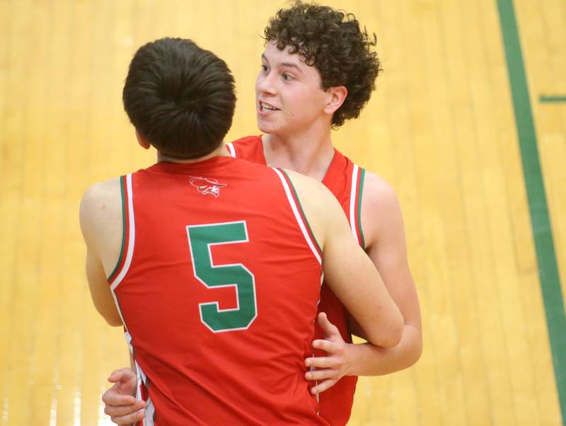 L-P's Mikey Hartman hugs teammate Erick Sotelo after beating Dixon during the Class 3A Regional semifinal game on Wednesday, Feb. 26, 2025 in Sellett Gymnasium at L-P High School.