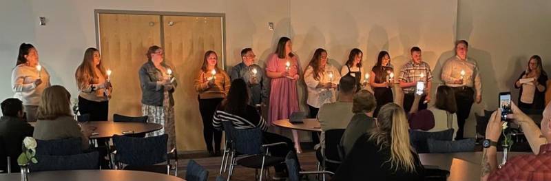 New Phi Theta Kappa Honor Society members light candles during their induction ceremony at Kankakee Community College on Oct. 24.