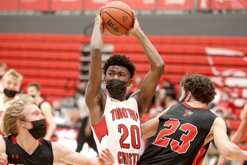 Timothy Christian's Josh Harris (20) holds onto the ball during a home game in Elmhurst against Benet Academy on Friday, March 12, 2021.