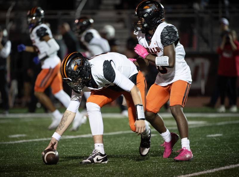 Dekalb's Cole Latimer picks up a fumbled snap in a game against Bradley-Bourbonnais on Friday, October 10, 2025.