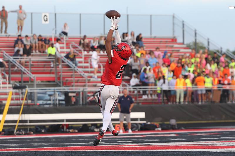 Bolingbrook’s Adrian Jones makes an athletic attempt on a high pass against Naperville North on Friday, Sept. 8, 2023 in Bolingbrook.