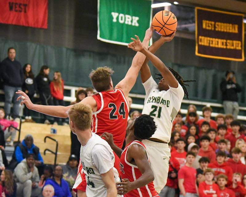 Glenbard East's Sam Walton (24) blocks the shot of Glenbard West's AJ Rayford (21) on Wednesday Nov. 26, 2025, during the District 87 Thanksgiving Invitational held at Glenbard West High School.