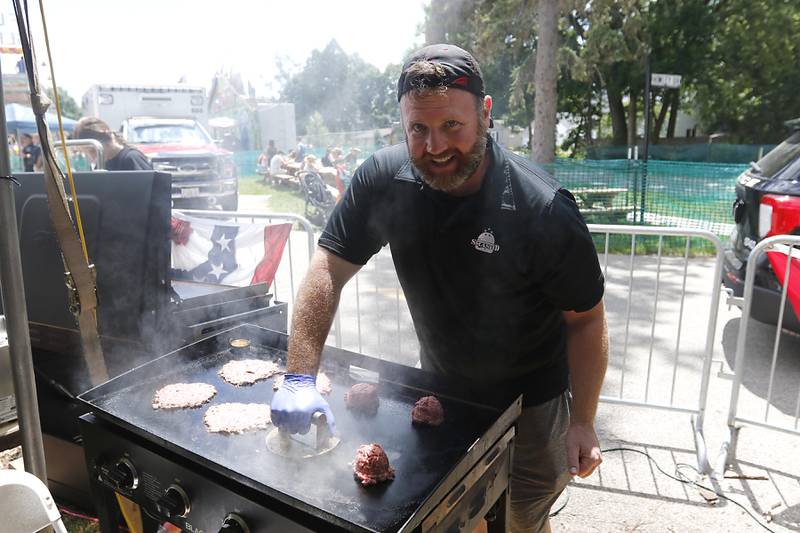 Kevin Byrnes, of Smash’D, cooks a smashed burger during Lakeside Festival on Friday, July 5, 2024, at the Dole.