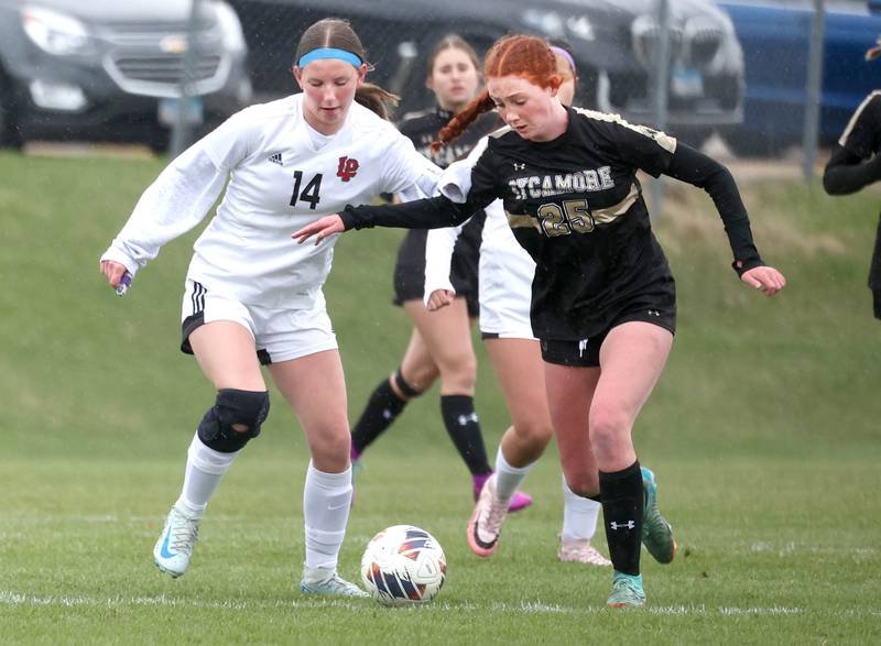 La Salle-Peru's Rosalie Leininger and Sycamore's Izzie Segreti go after the ball during their game Wednesday, April 9, 2025, at Sycamore High School.