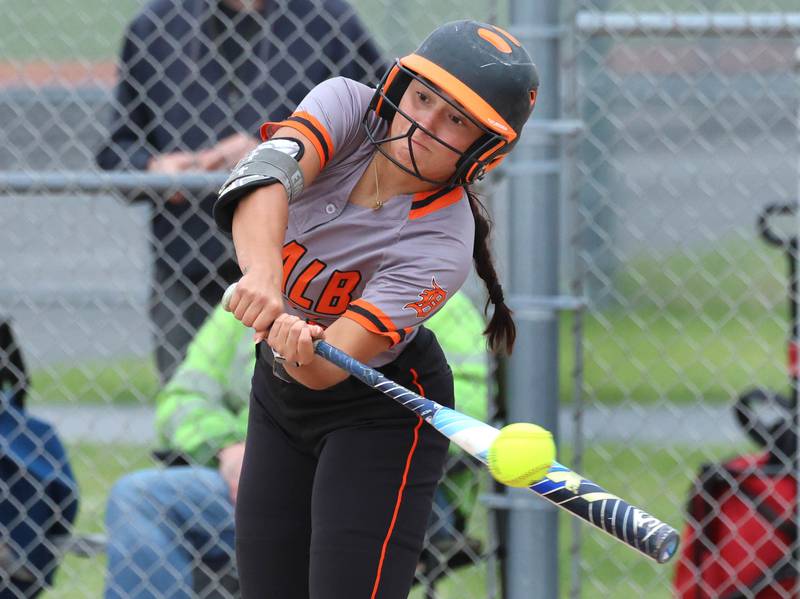 DeKalb's Emma Hart tries to slap the ball down the third base line Tuesday, May 19, 2026, during their Class 4A regional game against Harlem at DeKalb High School.