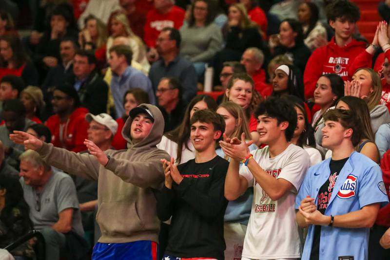 The Yorkville student section cheers on the team during their Class 4A Bolingbrook Sectional semifinal basketball game between Yorkville at Benet, March 3, 2026 in Bolingbrook.