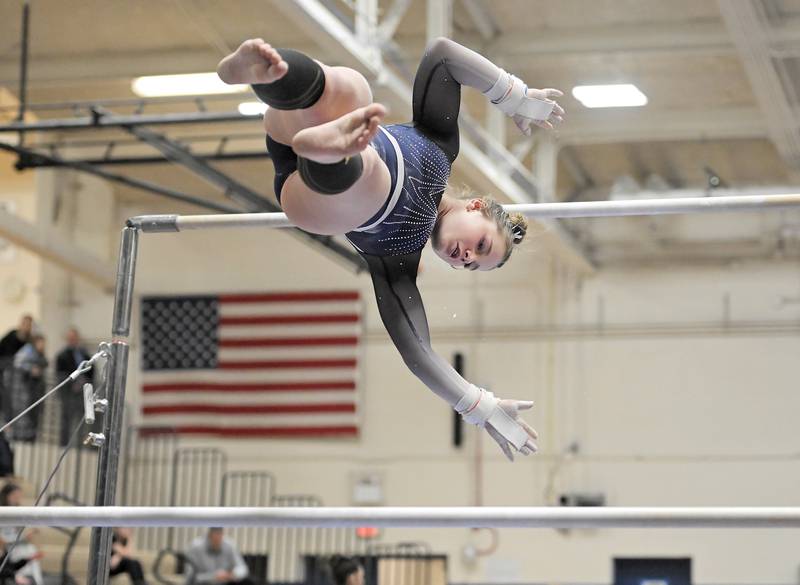 Jordyn McBride of St. Charles Co-op on the uneven bars at the Dukane Conference girls gymnastics regional meet at Lake Park High School in Roselle on Wednesday, Jan. 29, 2025.