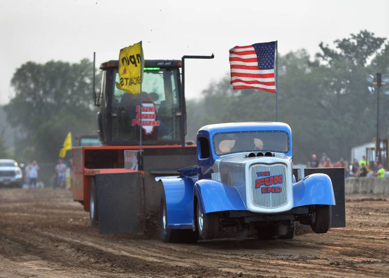 Tom Venhuizen of Morrison drives his 36 Chevy modified tractor "The Fun End" in the open division at the tractor pull at the Ogle County Fair on Thursday, July 31, 2025