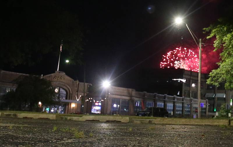 Fireworks light up the sky over the Westclox building during the "Rock the River" Independence Day fireworks on Thursday, July 3, 2025 in Peru.
