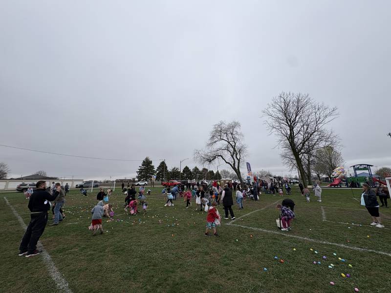 Children race across the grass at Peck Park during the annual Easter egg hunt Saturday, April 4.