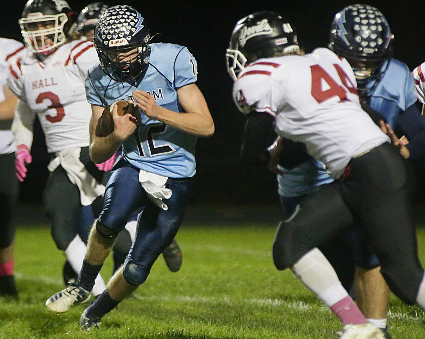 Bureau Valley's quarterback Adam Johnson (no,12) runs the ball against Hall on Friday Oct. 22, 2021.