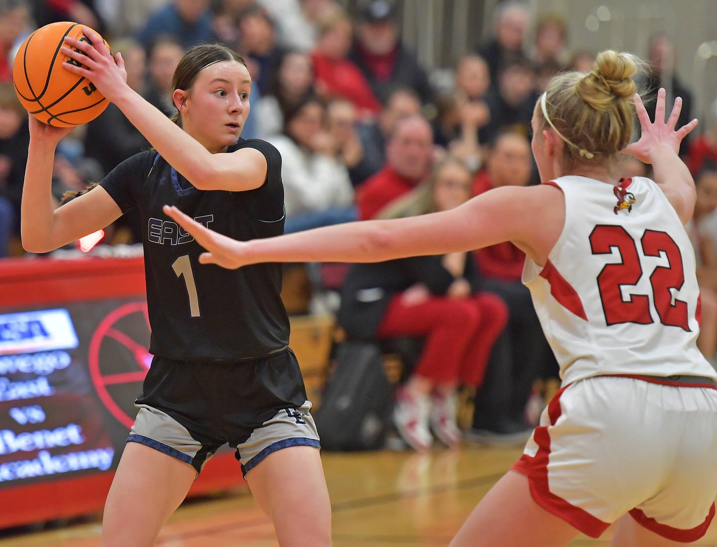 Oswego East’s Aubrey Lamberti (1) starts to pass as Benet’s Bridget Rifenburg (22) defends during the Class 4A Benet Regional final on February 19, 2026 at Benet Academy in Lisle.