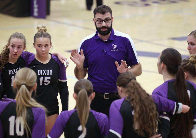 Dixon’s head coach Bunyan Cocar talks to his team between games against Ottawa Tuesday, Oct. 28, 2025, during their Class 3A regional semifinal match at Rochelle High School.