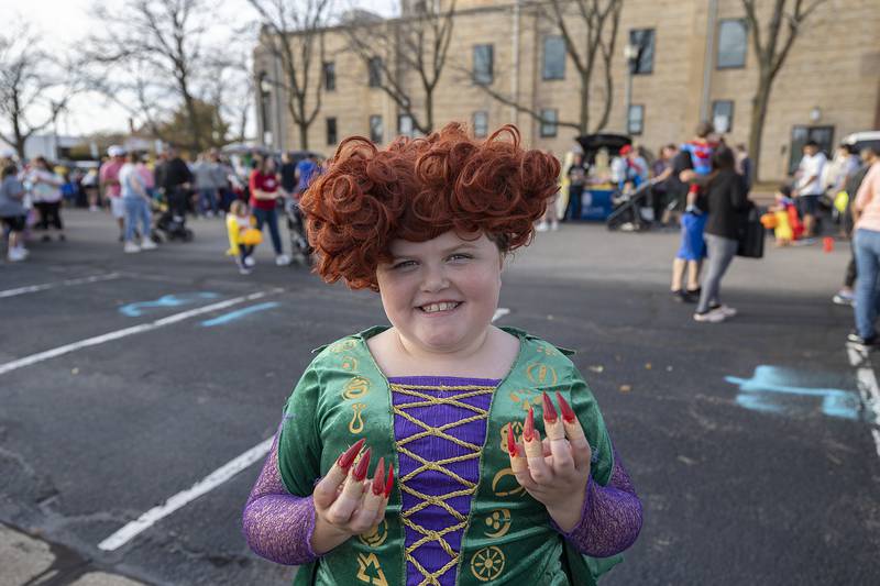 Ellie Ruiz, 8, shows off her claws dressed as Winnie from Hook Pocus Tuesday, Oct. 29, 2024, at the Sterling PD’s trunk or treat.