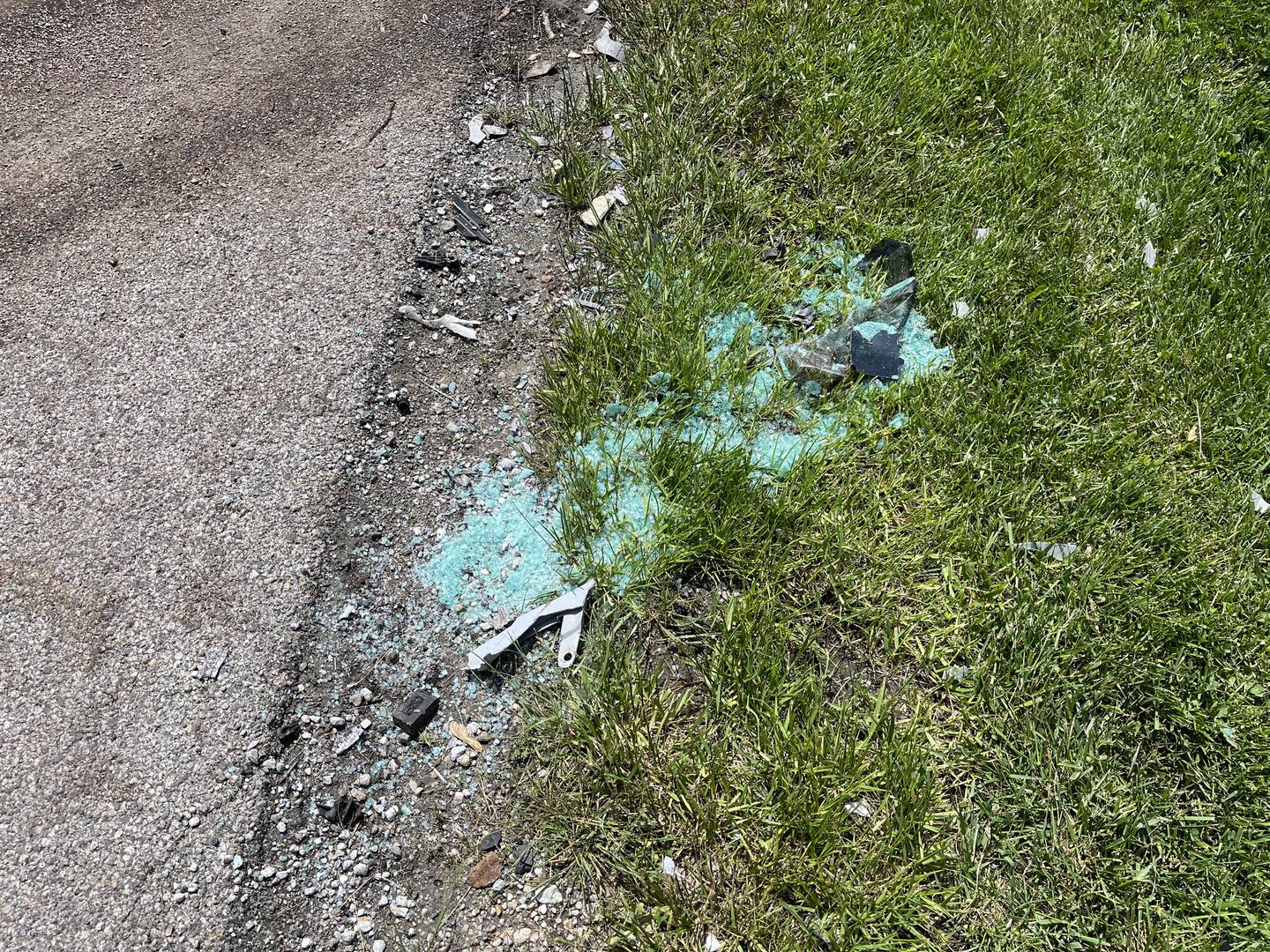 Shattered glass on the side of Route 52 at the intersection of Route 52 and Baker Road in Manhattan Township, seen on Sunday, May 22, 2022. A crash occurred on Saturday, May 21, 2022, that left three people dead.