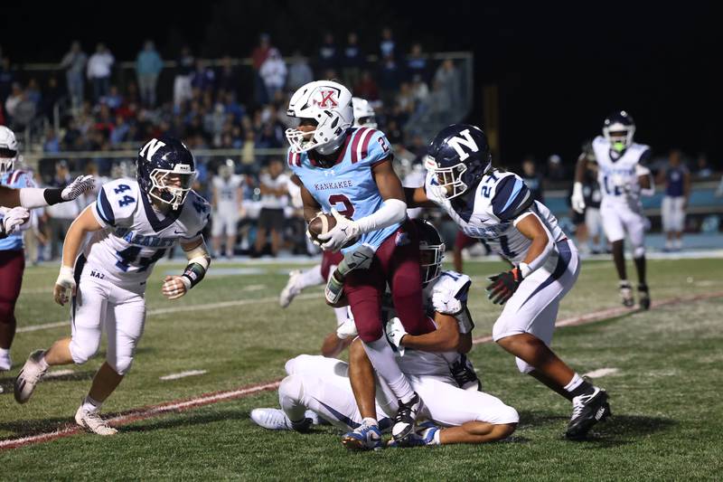 Kankakee's Ezekiel Sherrod is taken down by Nazareth defenders during Kankakee's 33-12 loss to Nazareth on Friday, Aug. 29, 2025.