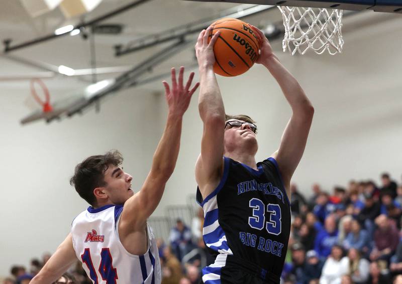 Hinckley-Big Rock's Marshall Ledbetter gets to the basket ahead of Ida Crown’s Ezra Comrov during their Class 1A sectional game Wednesday, March 5, 2025, at Somonauk High School.