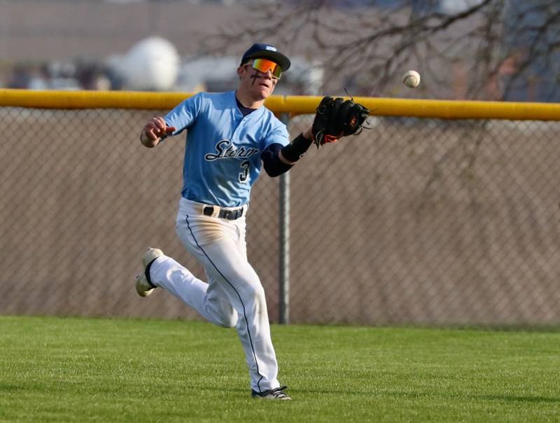 Bureau Valley left fielder Layton Britt tracks a fly ball in Thursday's game in Manlius. The Storm fell to rival Princeton 12-6.