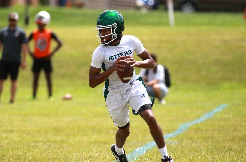 Glenbard West quarterback A.J. Rayford looks for a receiver during a 7 on 7 tournament on Thursday, June 26, 2025 at Naperville North.
