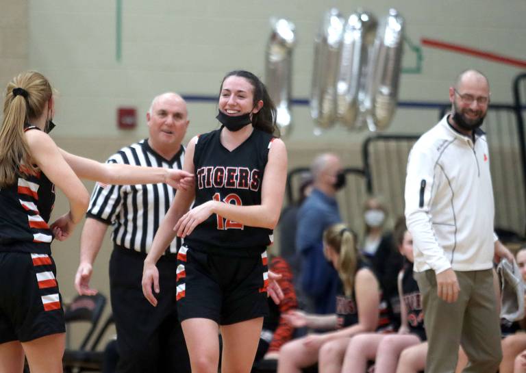 Patrick Kunzer for Shaw Local
Crystal Lake Central’s Paige Keller is all smiles after draining a free throw to record her 1,000th career point during varsity girls basketball action at Huntley Friday night.