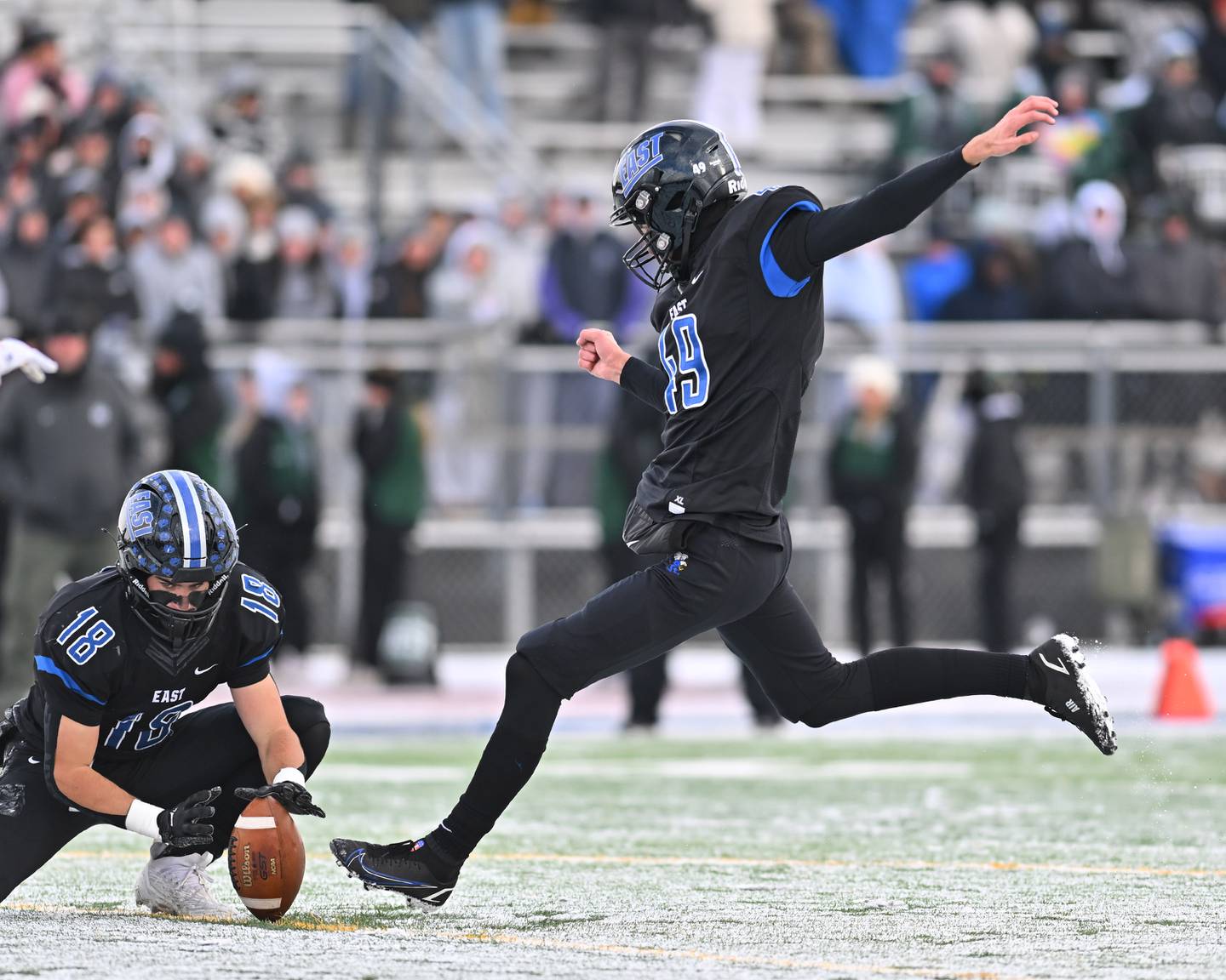 Lincoln-Way East's Carter Nair (49) tries the point after attempt during the IHSA Class 8A semifinals on Saturday, November 19, 2022, at Frankfort.