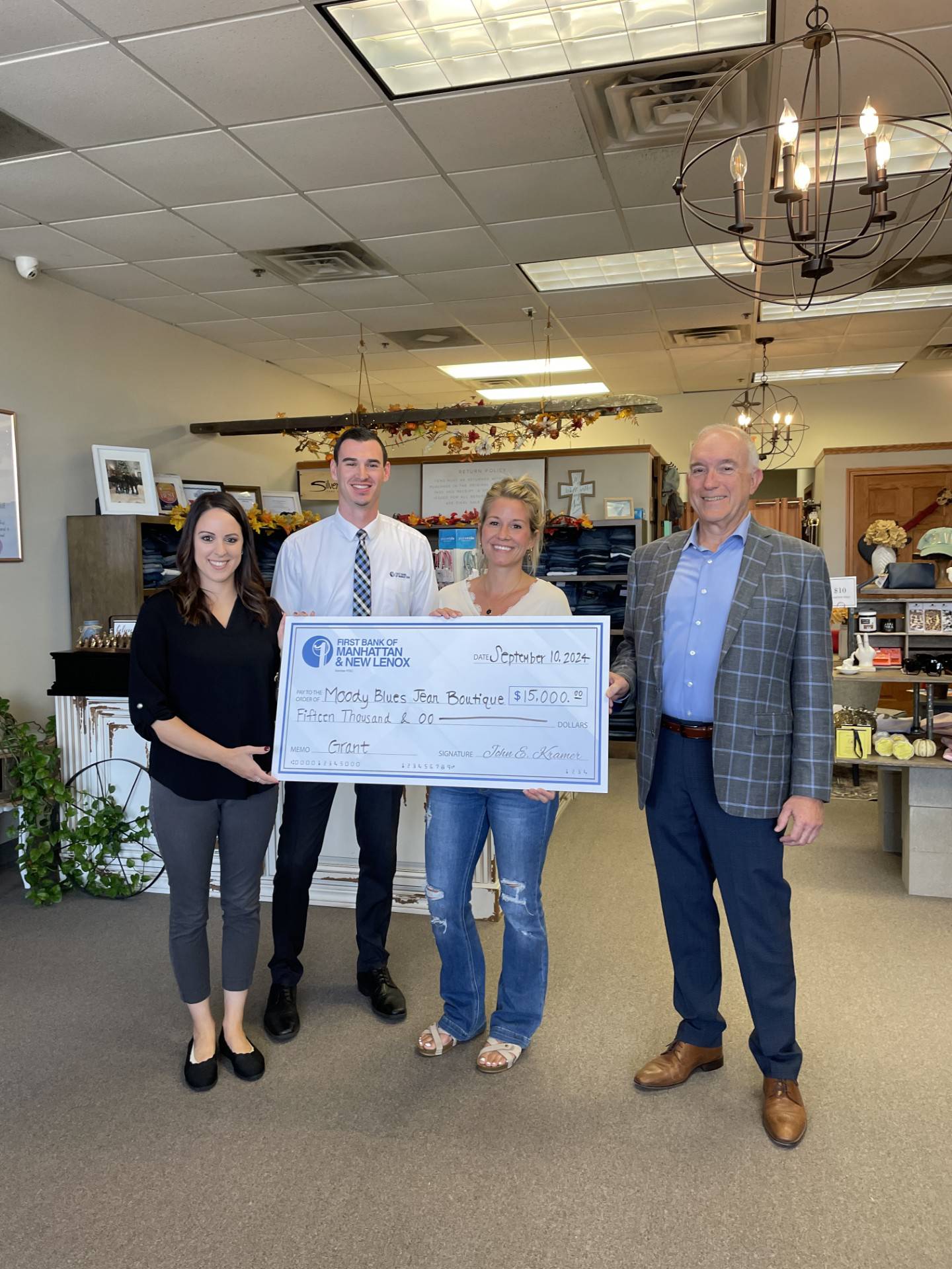 The Federal Home Loan Bank of Chicago (FHLBank Chicago) recently awarded Moody Blues Jean Boutique of New Lenox a $15,000.00 through its Community First Accelerate Grants for Small Business program. First Bank of Manhattan and New Lenox sponsored the grant. Pictured, from left, are Lauren Enix, senior commercial loan administrator, First Bank of Manhattan and New Lenox; Tyler McGrory, assistant vice president, loan officer, First Bank of Manhattan and New Lenox; Cahryssa Coldwater, owner, Moody Blues Jean Boutique; and Dave Zang, executive vice president, First Bank of Manhattan and New Lenox.