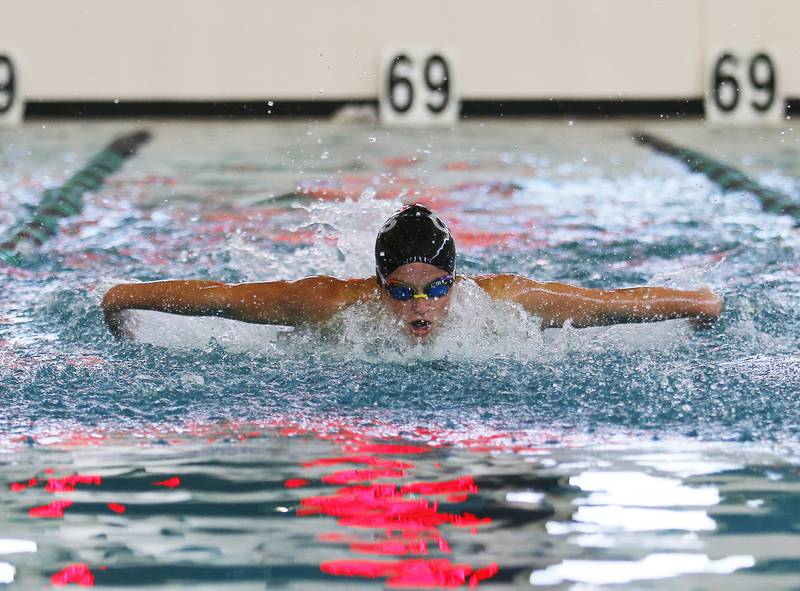 Crystal Lake Central Co-op's Avery Watson swims in the 100 Butterfly event during the Woodstock North Co-op swimming invitational on Saturday, September 18, 2021 at Woodstock North High School in Woodstock, IL.