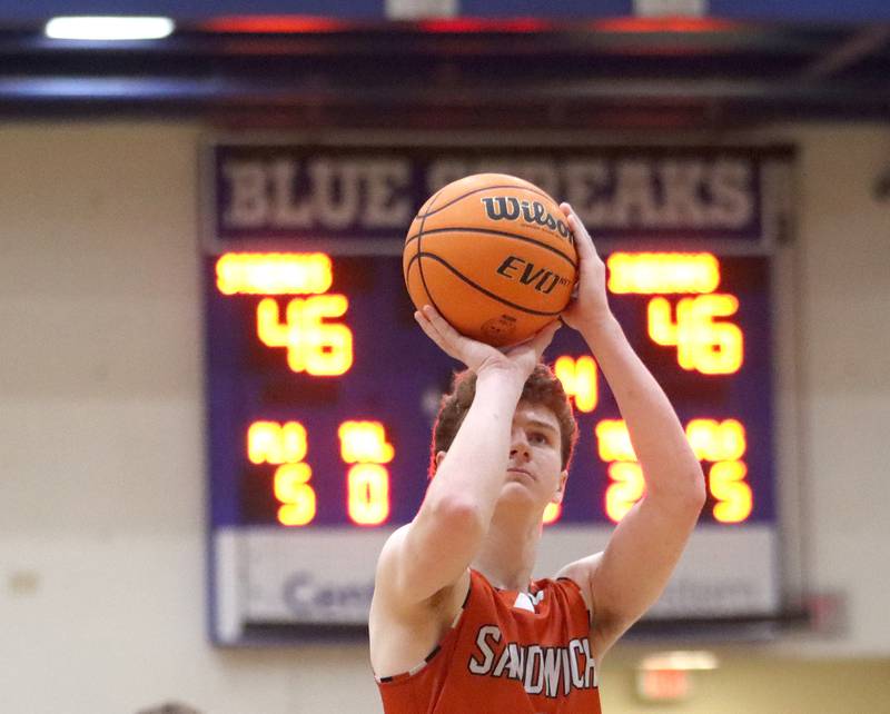 Sandwich’s Griffin Somlock shoots the game-winning free throw during the OT period in varsity boys basketball on Tuesday, Feb. 11, 2025, at  Woodstock High School in Woodstock.