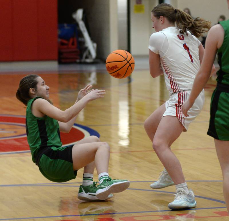 Oregon's Madison Shaffer (1) and Rock Falls' Abbygayle Schofield (10) fight for a loose ball during 2A regional action on Saturday, Feb. 15, 2025 at Oregon High School.